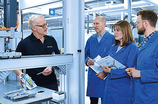 Technician and three customers during a dispensing test